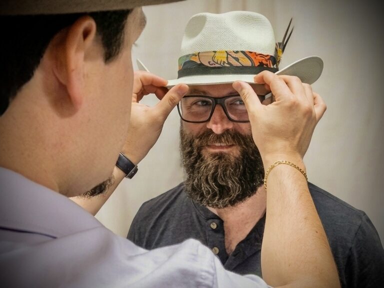 The mirror reveal — shaping a bespoke hat together