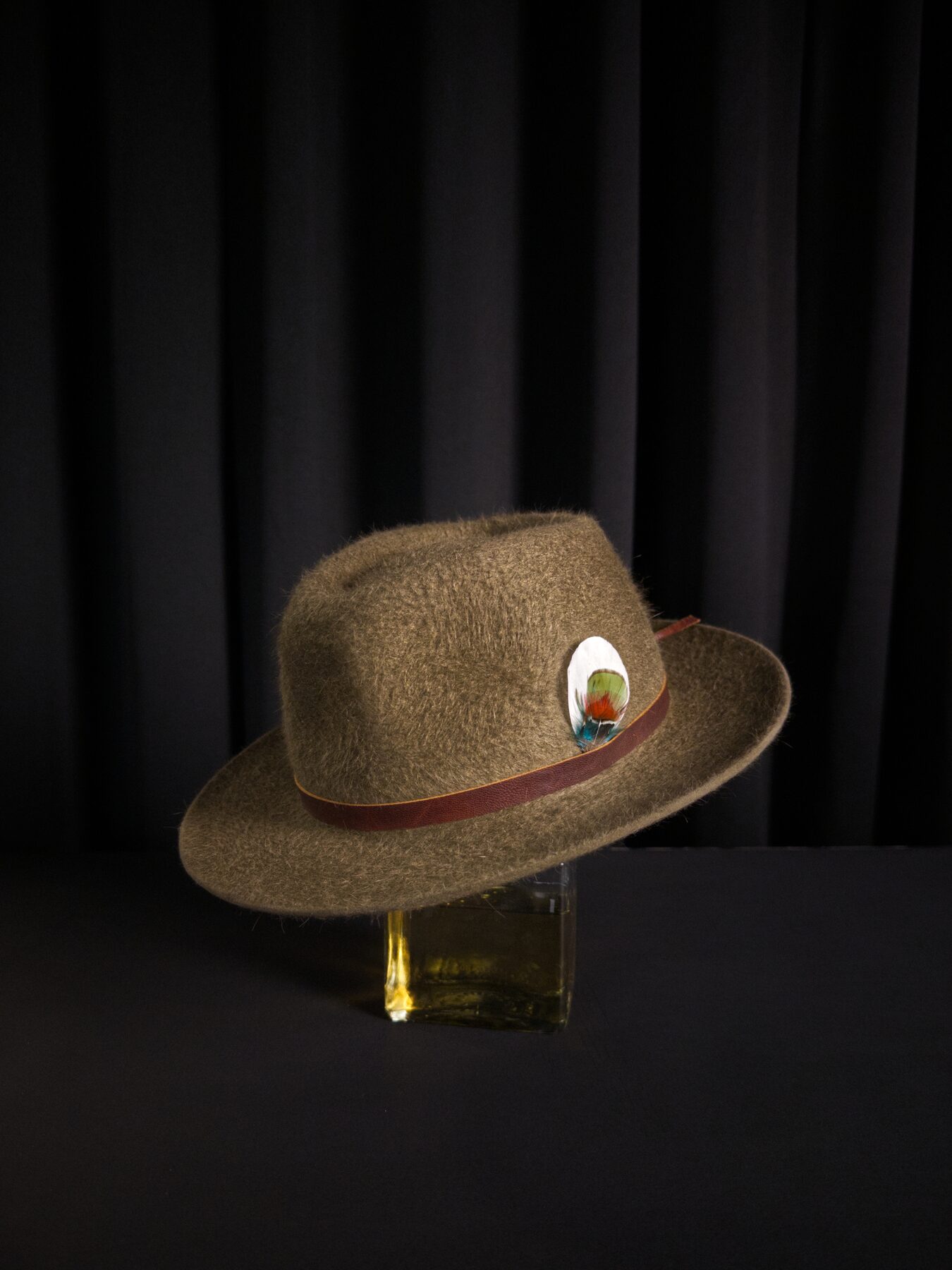 Bespoke fur-felt hat worn, low-key editorial frame — Alta Aura Designs